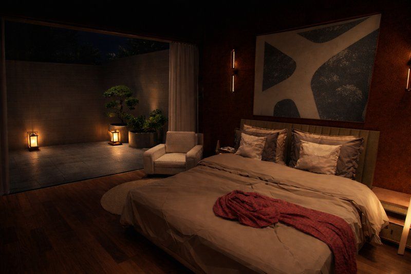 Bedroom with warm lighting, rich fabrics and a dark feature wall